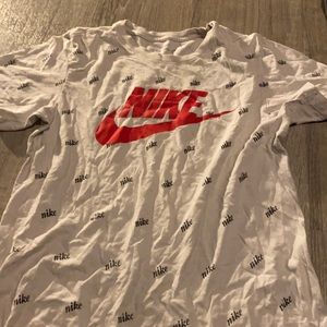 Nike t shirt with Nike design all over it